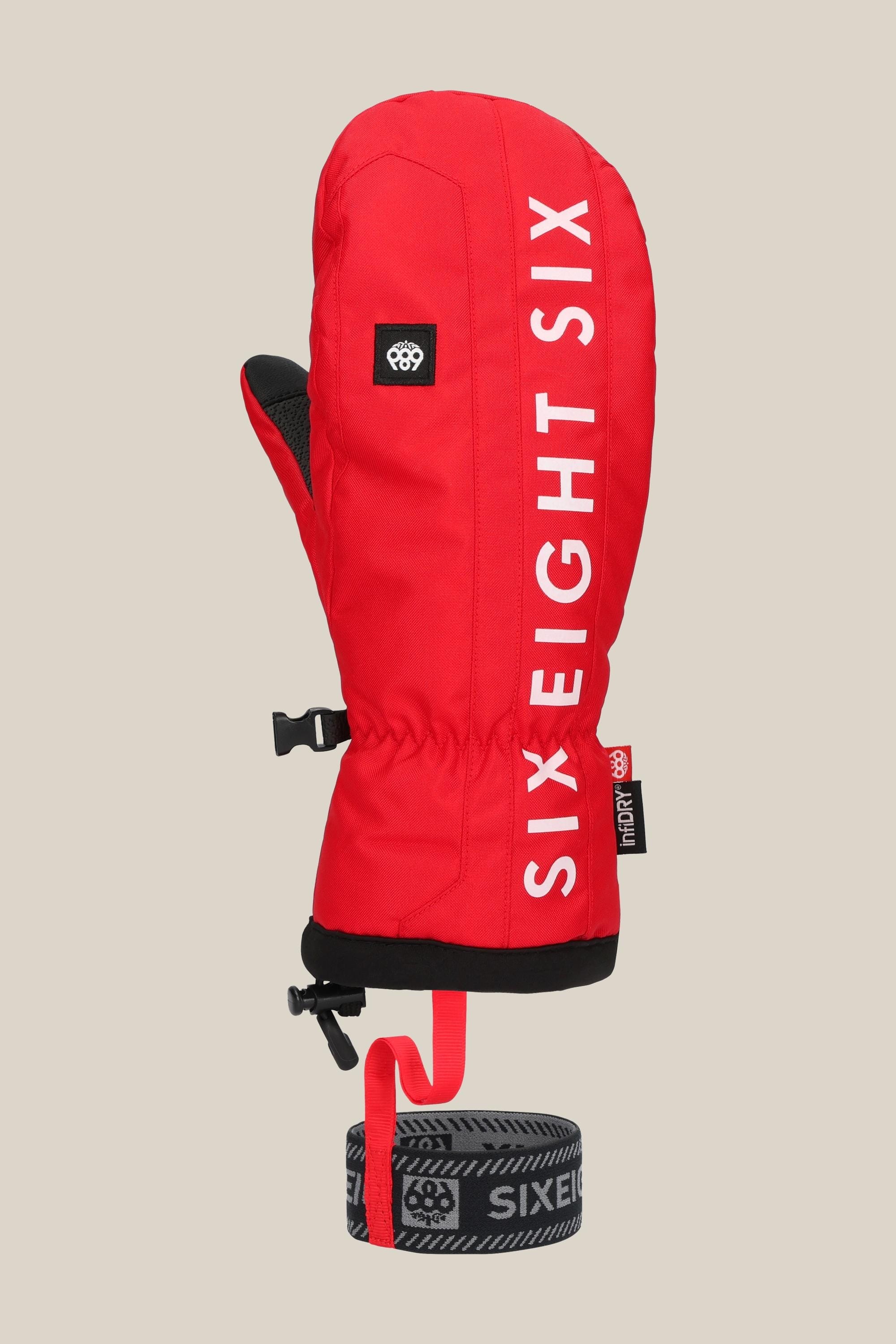 The 686 Mens Team Merino Mitt is a bright red mitten with internal finger separation for extra warmth, white SIX EIGHT SIX print, black adjustable wrist strap, black and grey detachable leash, on a light beige background.