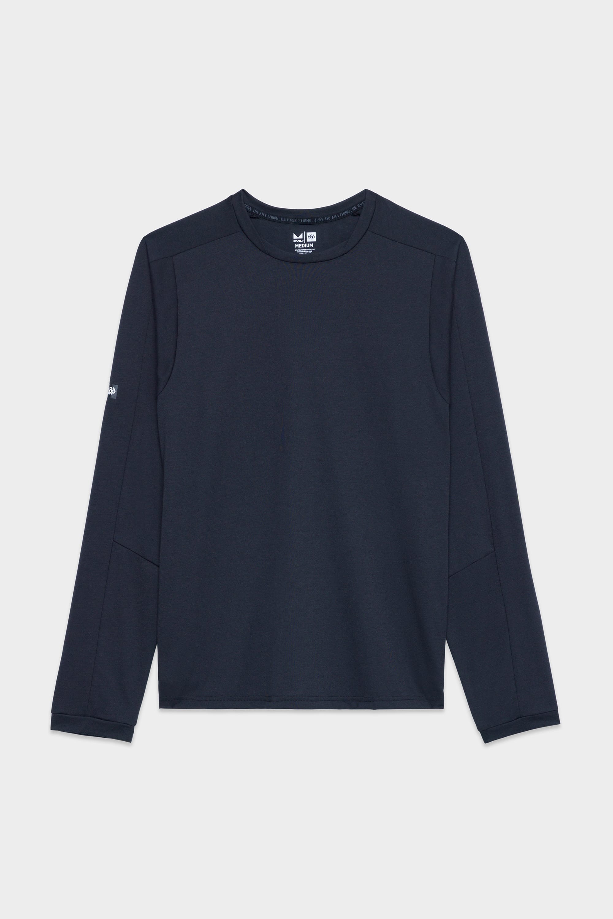 The 686 Mens Rival Long Sleeve Bike Jersey from 686 is shown in navy blue with a crewneck, minimal stitching, and a small logo on the left sleeve, laid flat on a white background.