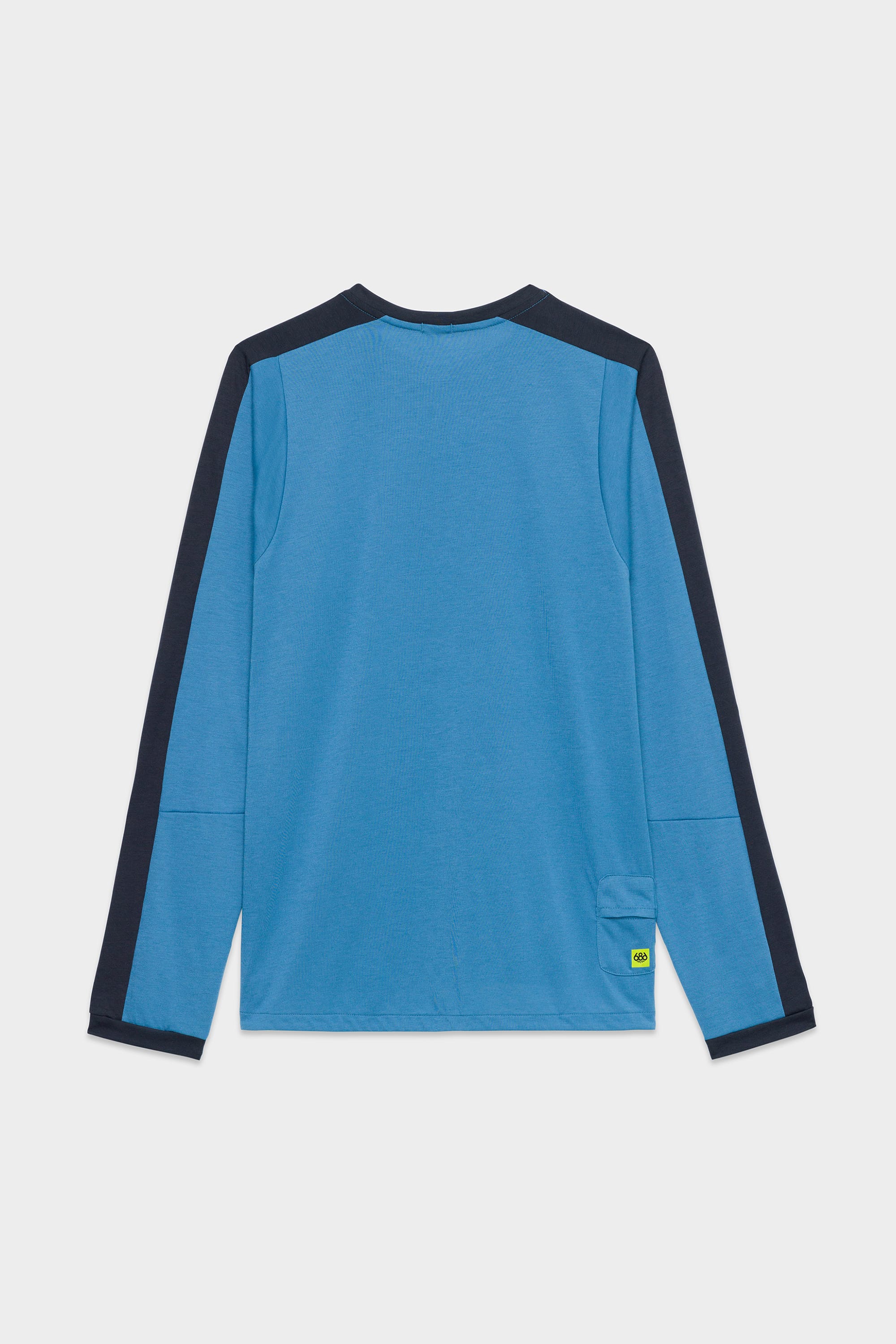 The 686 Mens Rival Long Sleeve Bike Jersey by 686 features blue fabric with dark navy panels on the sleeves and shoulders, shown from the back. A small green and yellow tag appears near the bottom right hem.