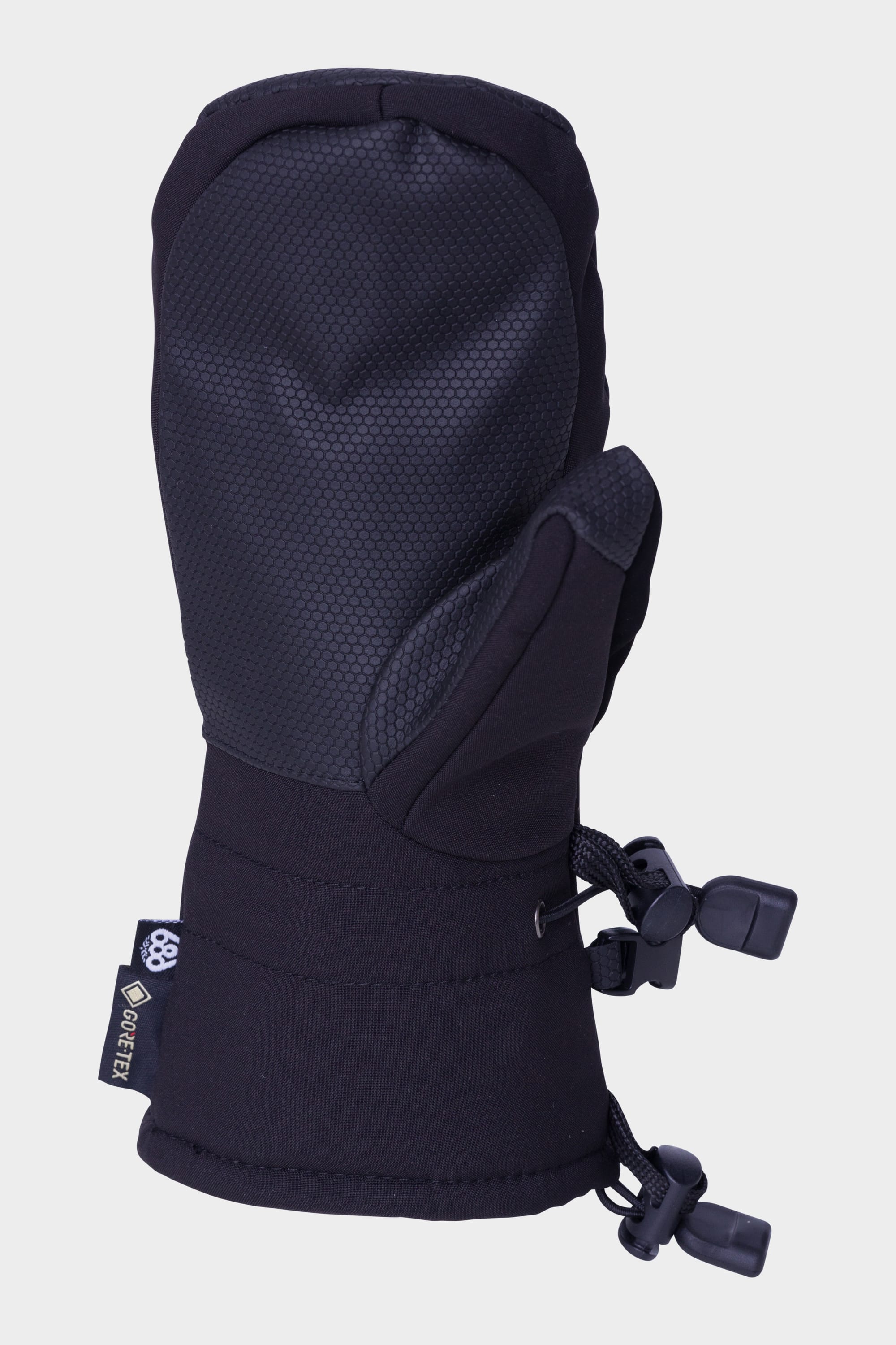 The 686 Youth GORE-TEX Linear™ Mitt by 686 is a black winter mitten with palm grip, adjustable wrist and cuff straps, and a side tag. Shown solo on a plain white background, this mitt offers warmth and durability for young wearers.