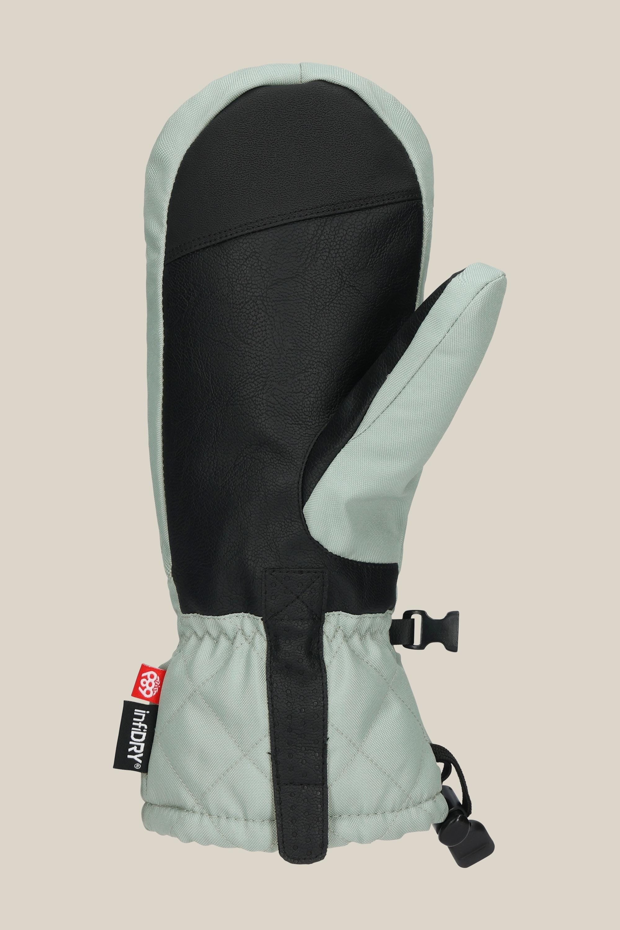 The 686 Women's Jubilee™ Mitt by 686 is a single light gray and black waterproof mitt featuring light insulation, a quilted cuff, black palm, clip, and red-and-black tag, shown against a beige background.