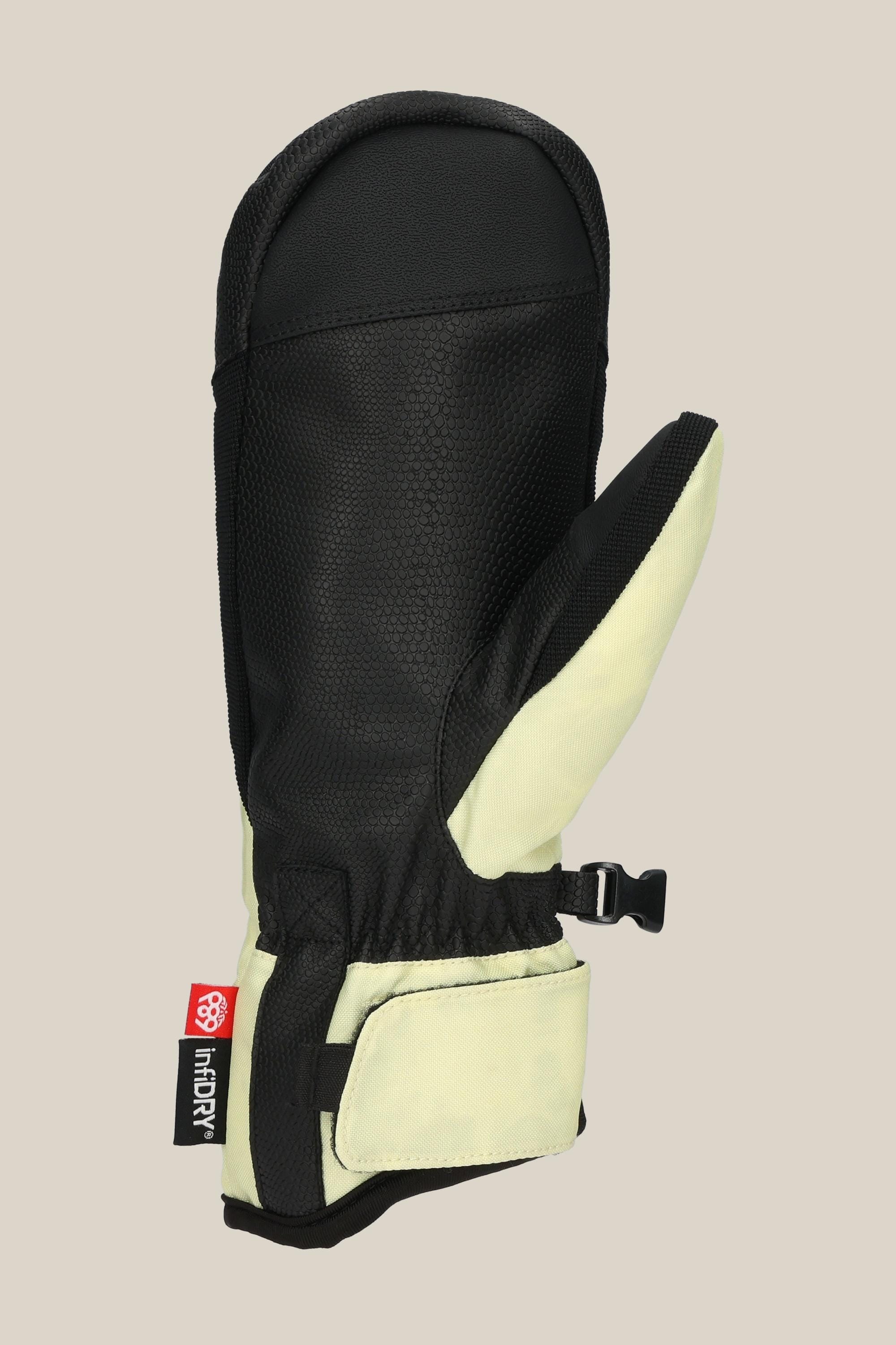 The 686 Womens Revel Mitt by 686 features black and light yellow colors, a textured palm, adjustable wrist strap, and a HiDRY fabric tag on the cuff, shown against a plain beige background.
