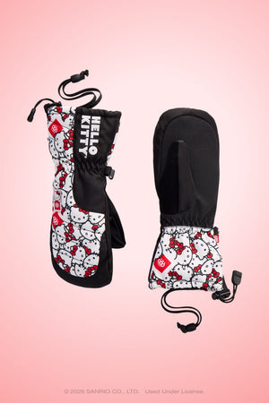 Two black 686 Youth Heat Insulated Mitts are pictured on a pink background, one displaying the front and the other showing the palm side. Both mittens feature adjustable cords at the wrists.