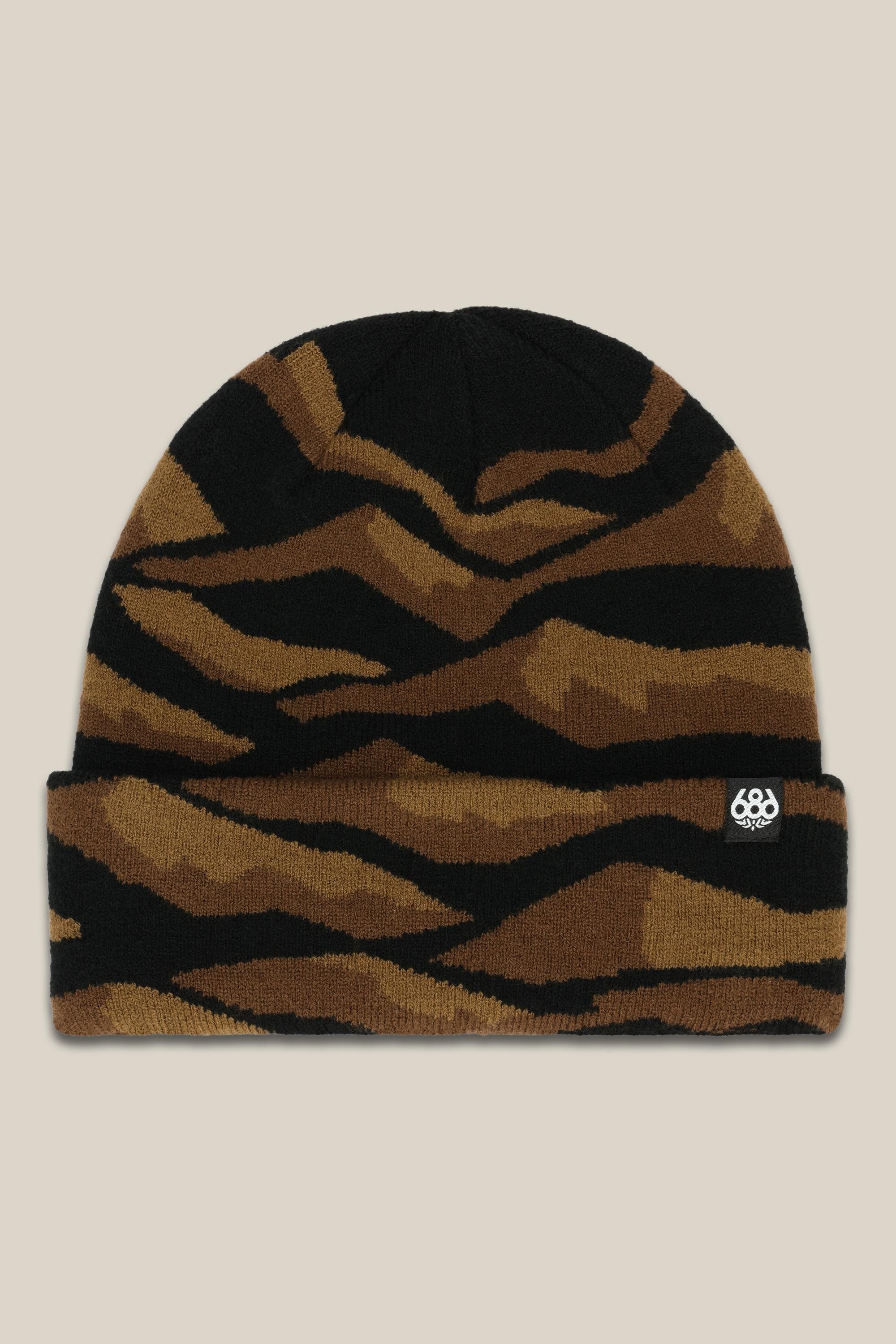 The 686 Summit Beanie features a brown and black tiger stripe knit, a small white 686 logo on the cuff, and is shown on a beige background—perfect for your next adventure.