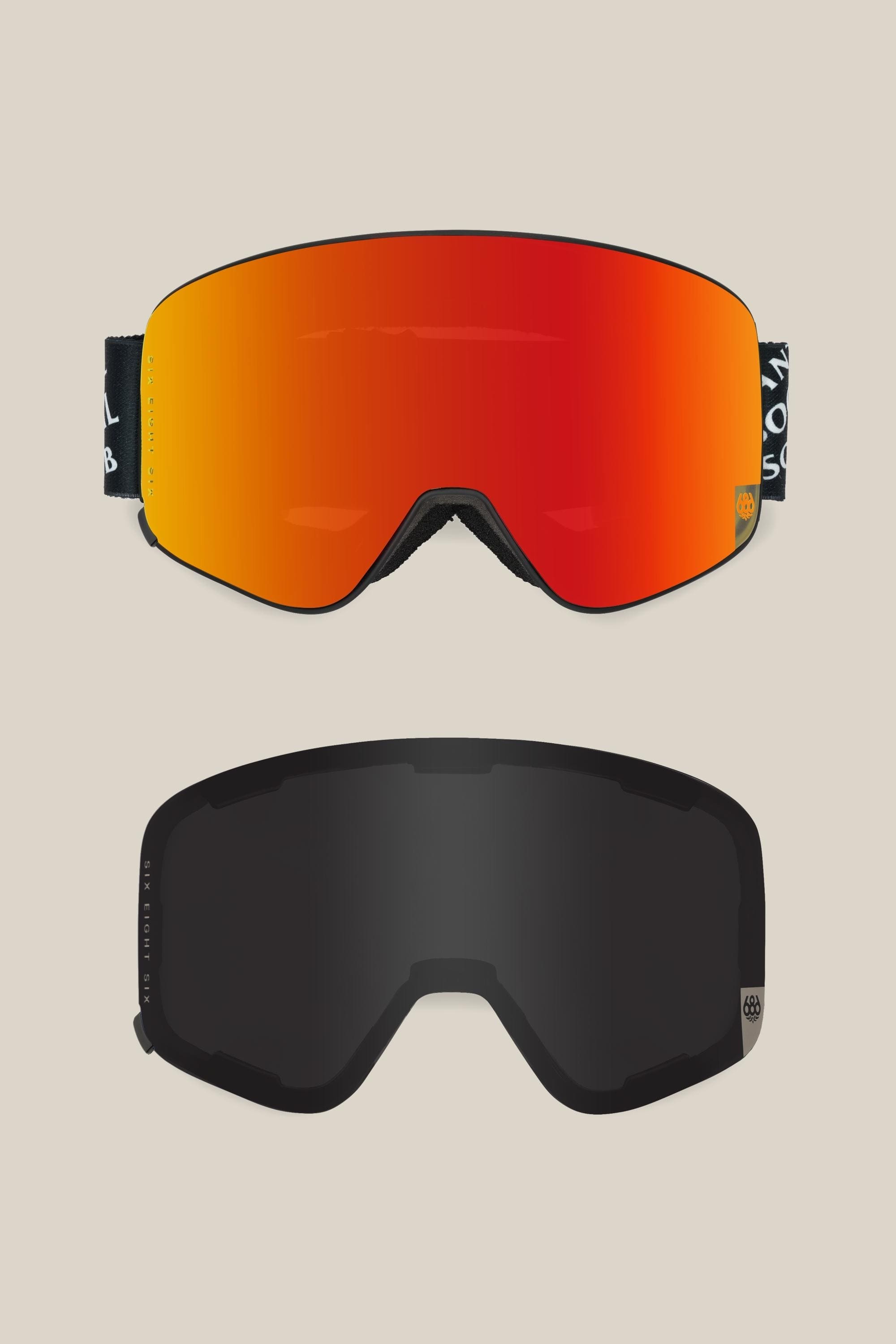 Two 686 SMARTY® Magnetic Goggle lenses are shown: the top is red-orange and reflective, the bottom is dark tinted black. Both curved lenses display a small circular logo on the frame edge, representing the 686 brand.