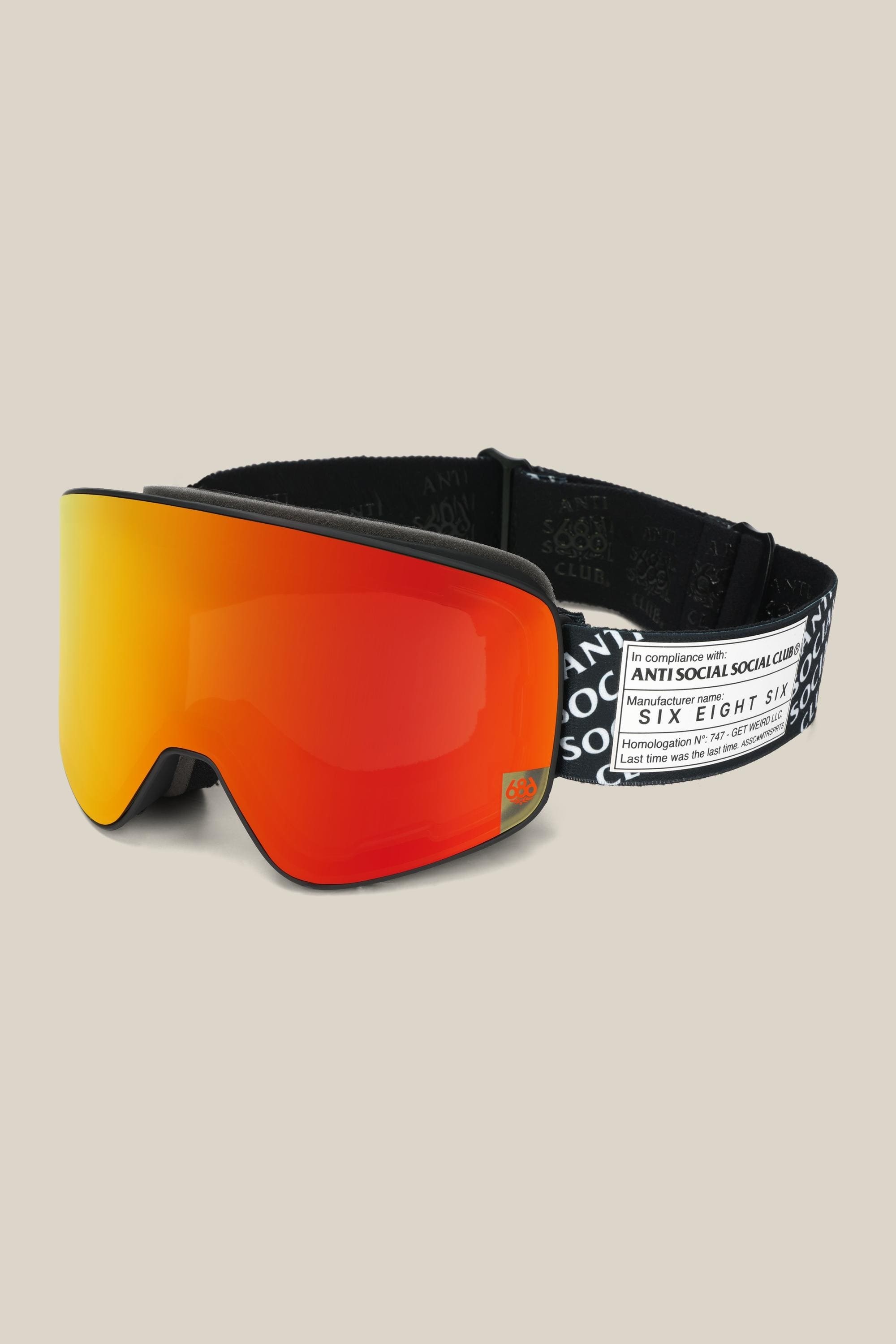 The 686 SMARTY® Magnetic Goggle features a wide orange-red reflective lens and a black strap with white branding from Antisocial Social Club and 686.