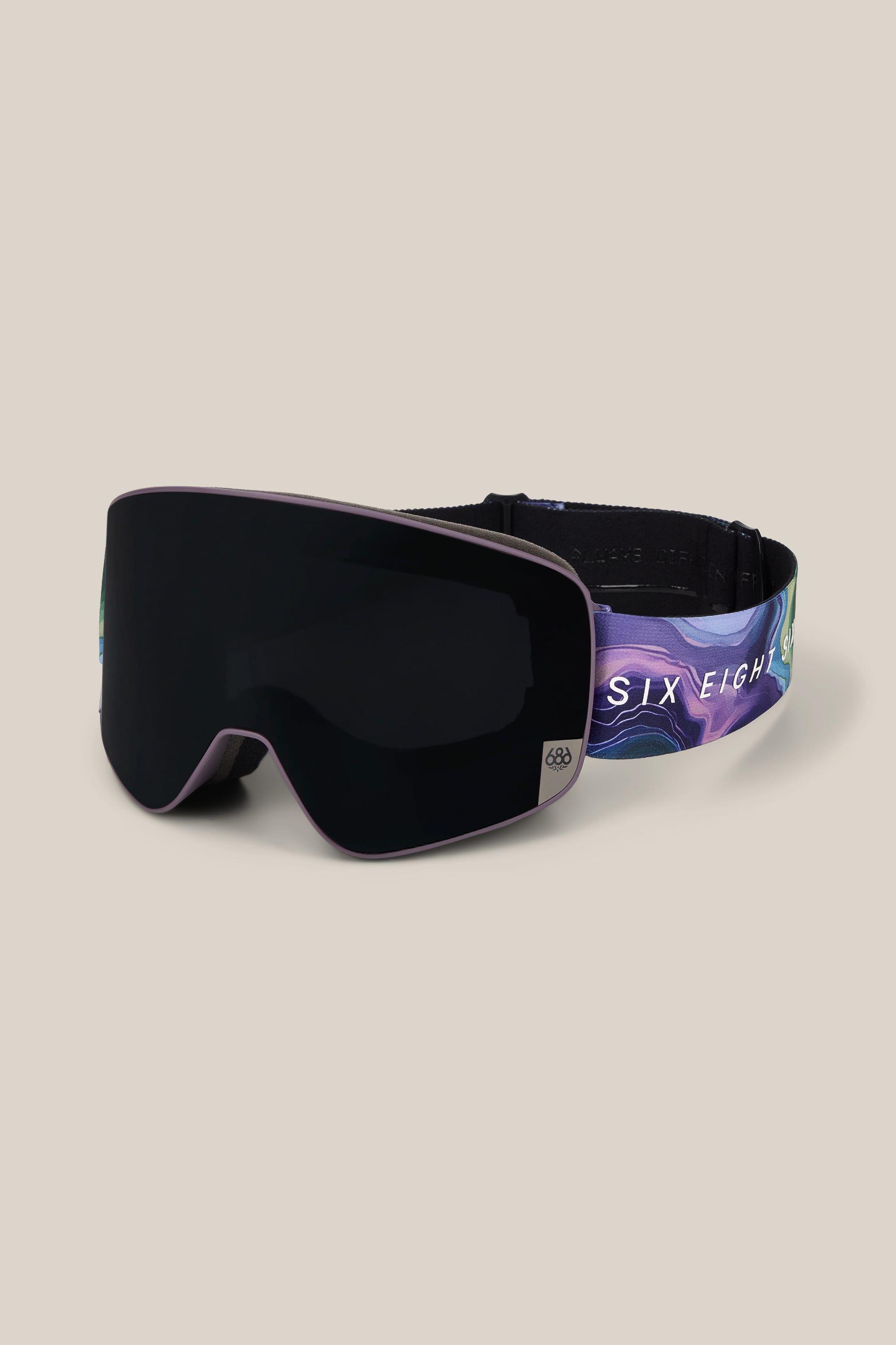 The 686 SMARTY® Magnetic Goggle by 686 features a black frame with a reflective lens and a vibrant, wavy-patterned strap displaying the text SIX EIGH. The goggles are showcased against a neutral background.