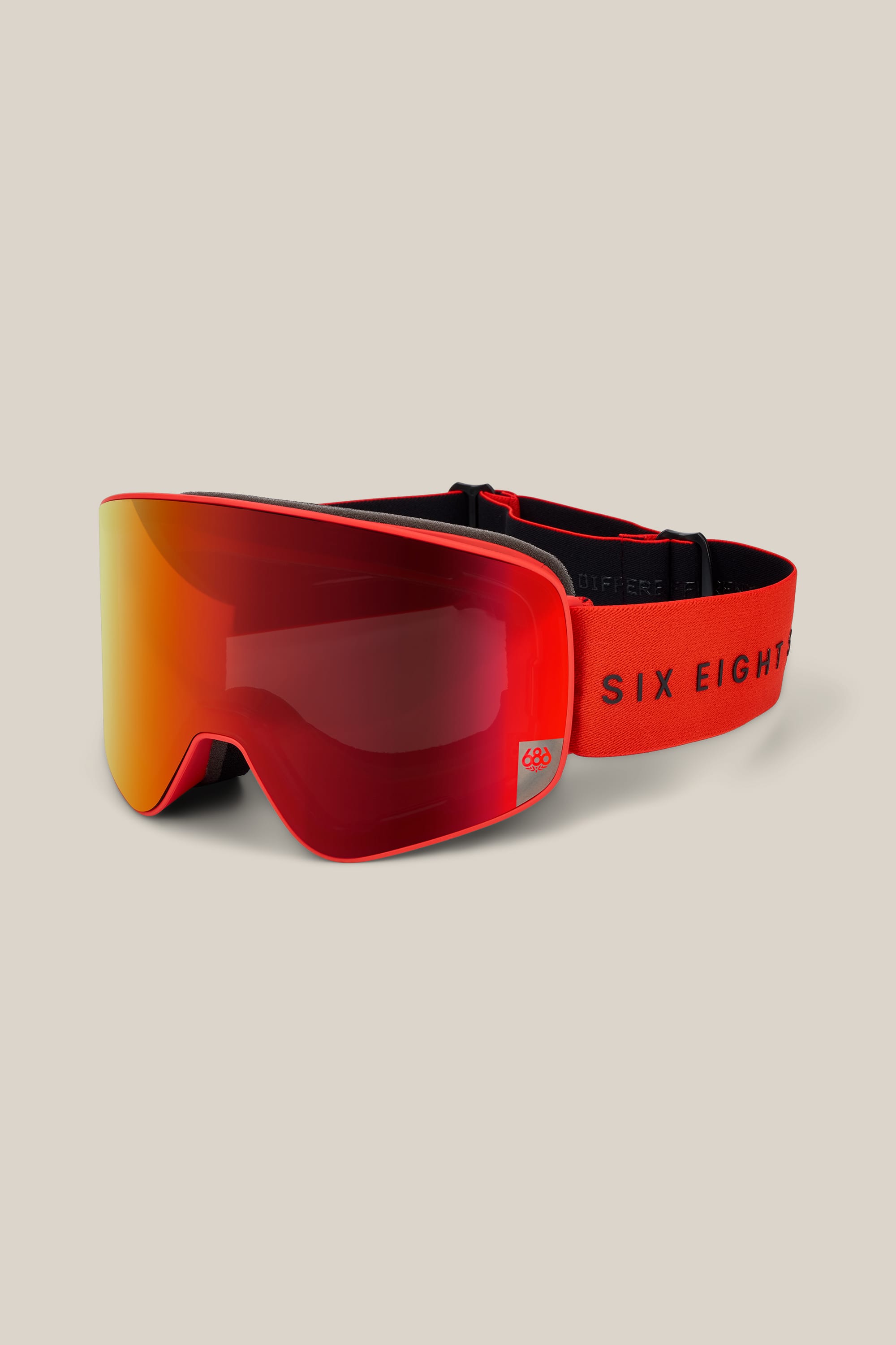 686 SMARTY® Magnetic Goggle in red and orange with a reflective lens, featuring a black adjustable strap and “686” branding in black on the band, displayed on a light beige background.