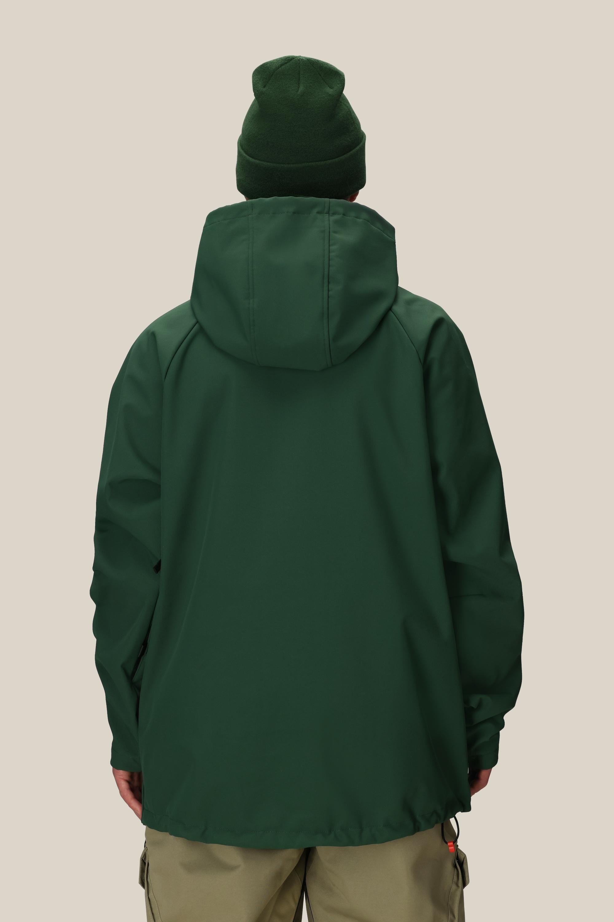 A person is shown from the back against a plain light background, wearing the 686 Men’s Waterproof Hoody in dark green and a green beanie, paired with beige pants.