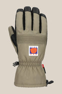 The 686 Lander™ Glove by 686 is a beige insulated glove with black fingertips and palm, a bear logo patch, adjustable wrist strap, waterproof build, and a side plastic clip.
