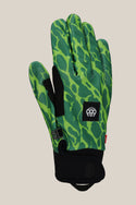 The 686 Outlaw Pipe Glove by 686 features a green design with a black abstract pattern, black palm and wrist, an adjustable strap at the wrist, and a small black patch with a white 889 logo on the back.