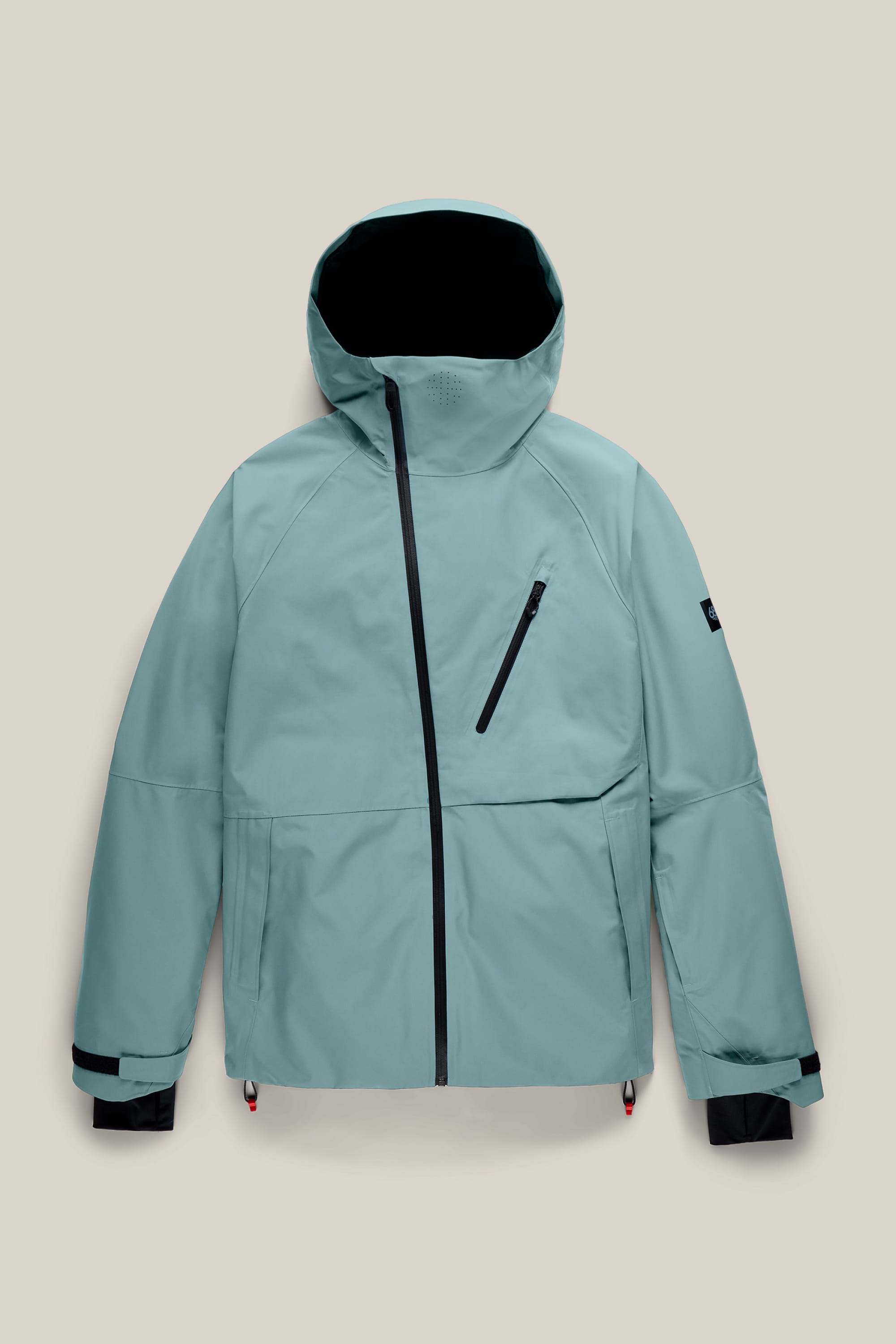 686 Men’s Hydra™ Thermagraph® Jacket by 686 in light blue, featuring a hood, black zipper accents, a chest pocket, and two front pockets, displayed flat on a beige background.