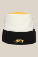 The 686 Flatop Fleece Hat is a men’s knit beanie by 686 featuring a yellow top, white middle, black fold-over brim, and an oval front logo displaying the numbers 686.