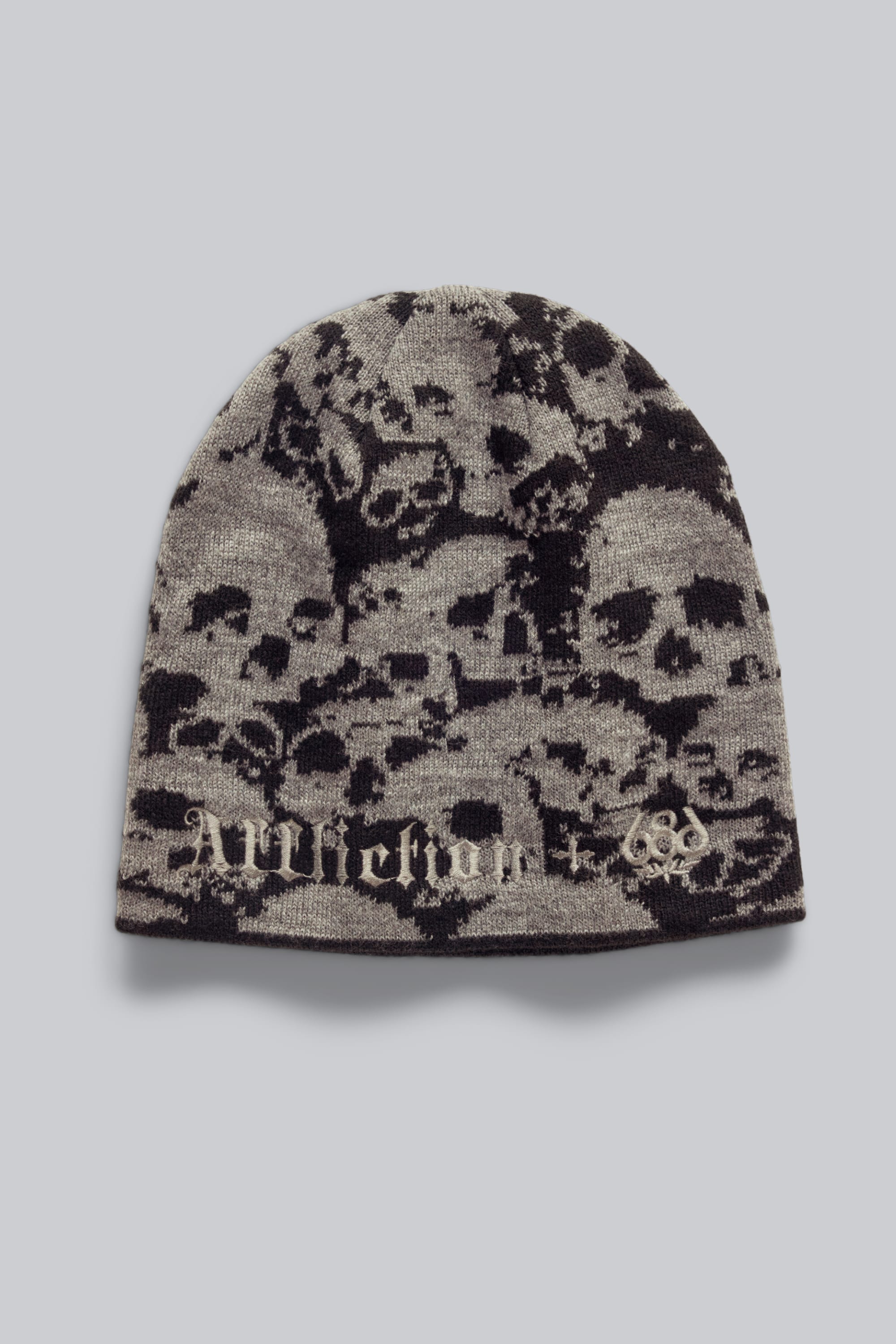 The 686 Affliction Beanie by 686 is a gray men's knit beanie with a black skull pattern and "Alltimers" in Old English-style font on the front.