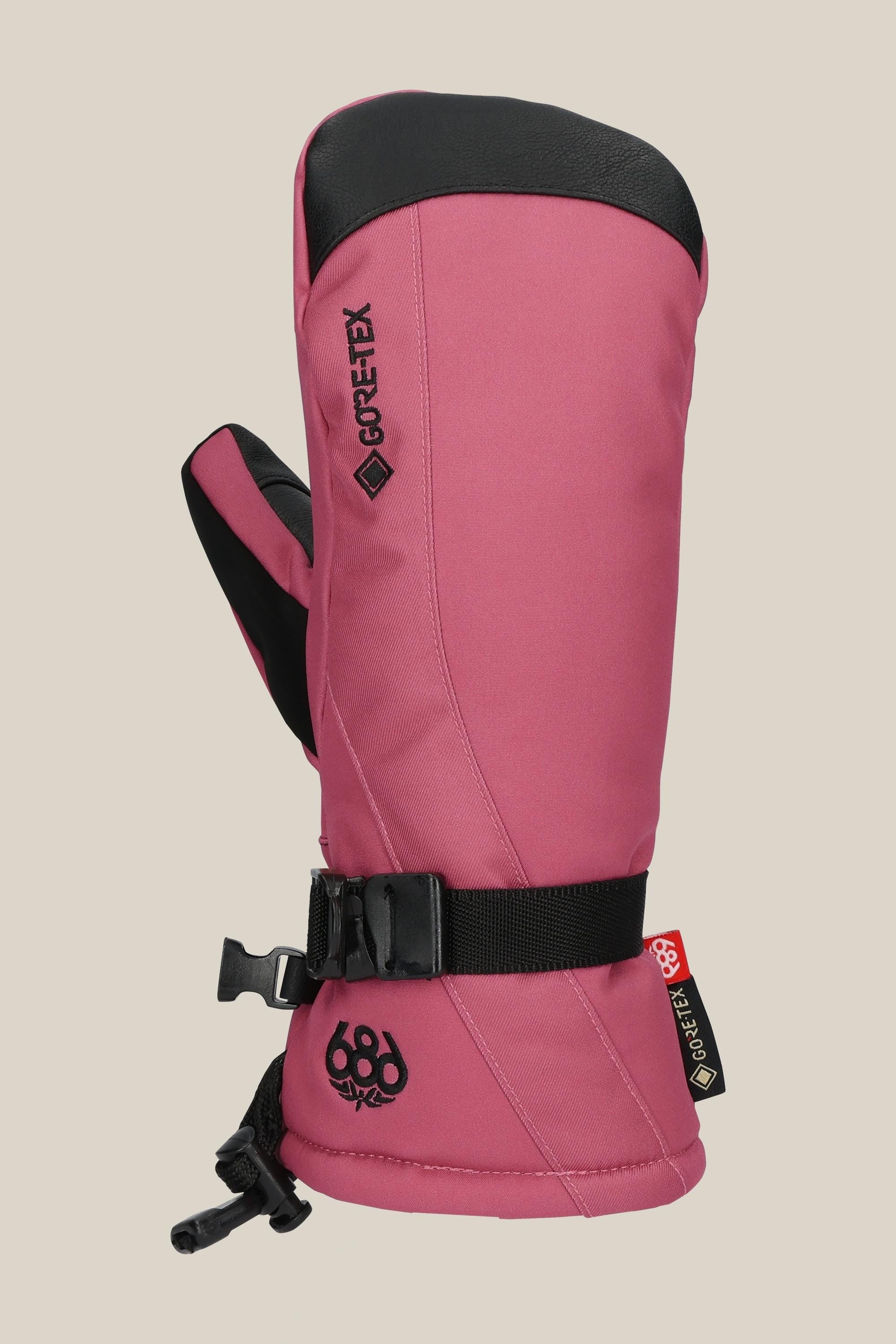 The 686 Women's GORE-TEX Linear™ Mitt, in pink with black PU accents, features an adjustable wrist strap and the 686 logo near the cuff, shown on a neutral background.