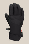 The 686 Women's GORE-TEX Linear™ Under Cuff Glove is shown upright, palm away, in black with a Velcro wrist strap, GORE-TEX tag, and side clip on a beige background—a stylish winter glove from 686.