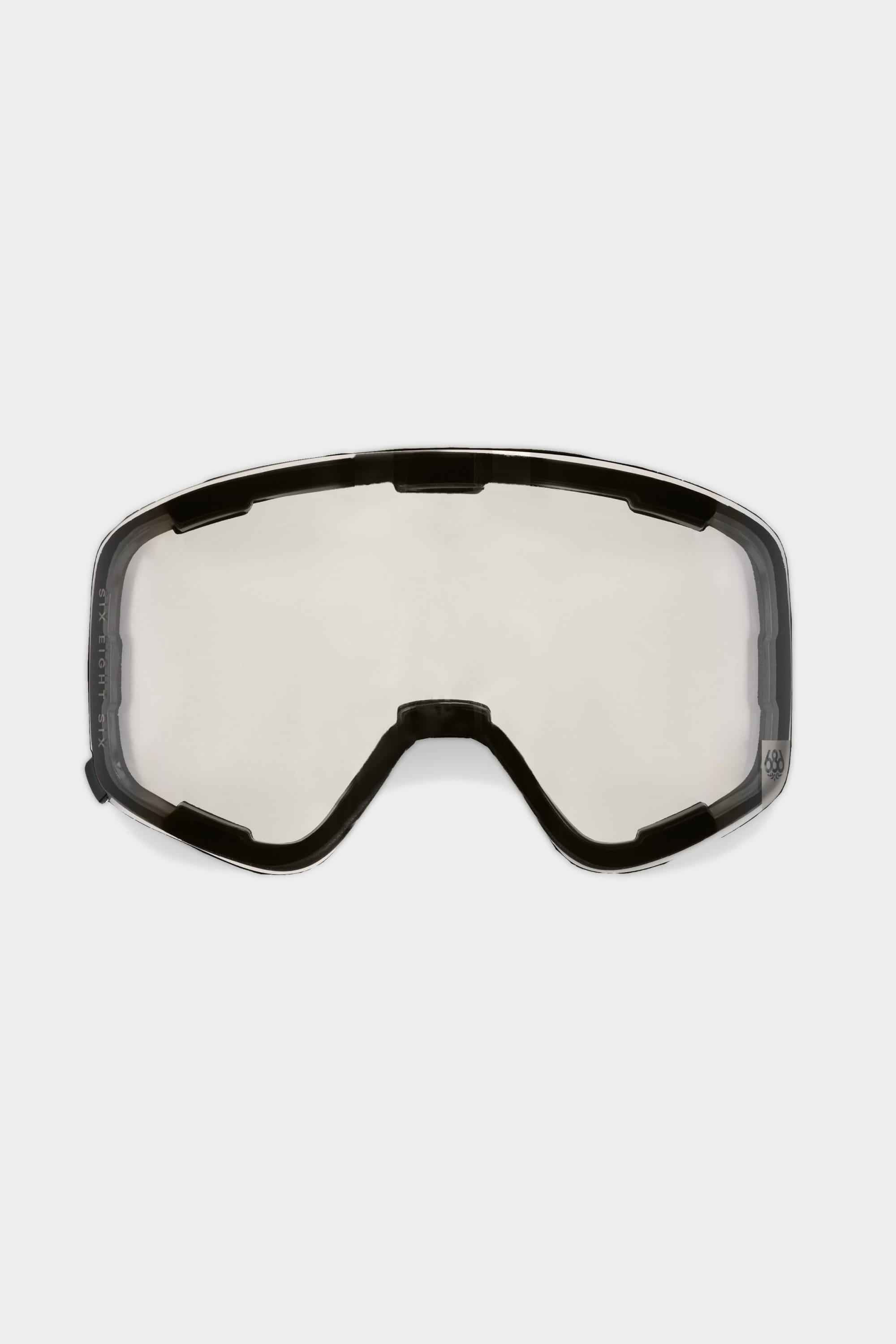 The 686 SMARTY® Magnetic Goggle Replacement Lens by 686 is a clear, frameless lens with a black edge, designed for easy lens swaps in sports or safety goggles; shown here against a plain white background.