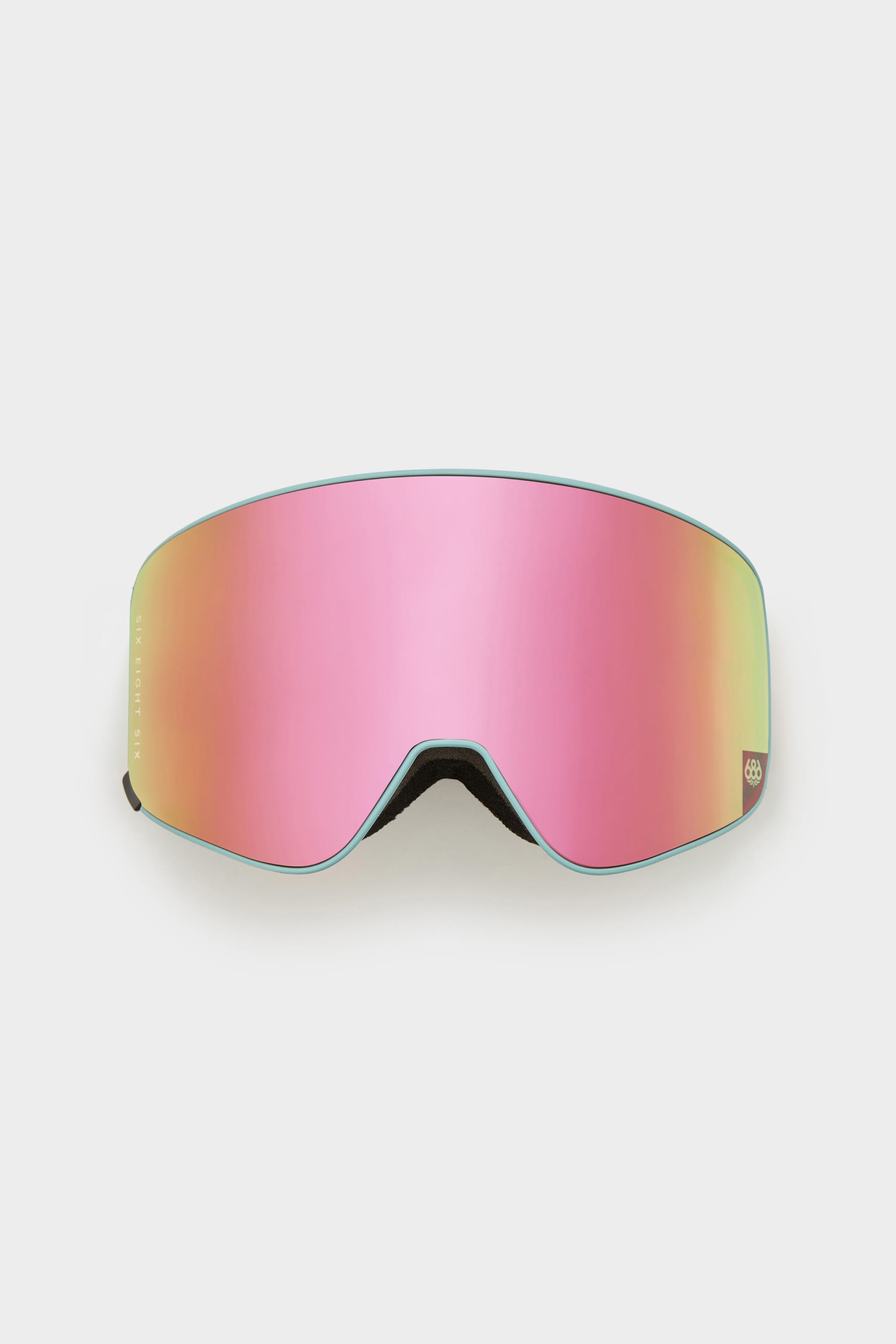 The 686 SMARTY® Magnetic Goggle Replacement Lens by 686 features a large curved reflective pink magnetic lens and a minimal black frame, making it easy to swap lenses on the slopes. Displayed against a white background.