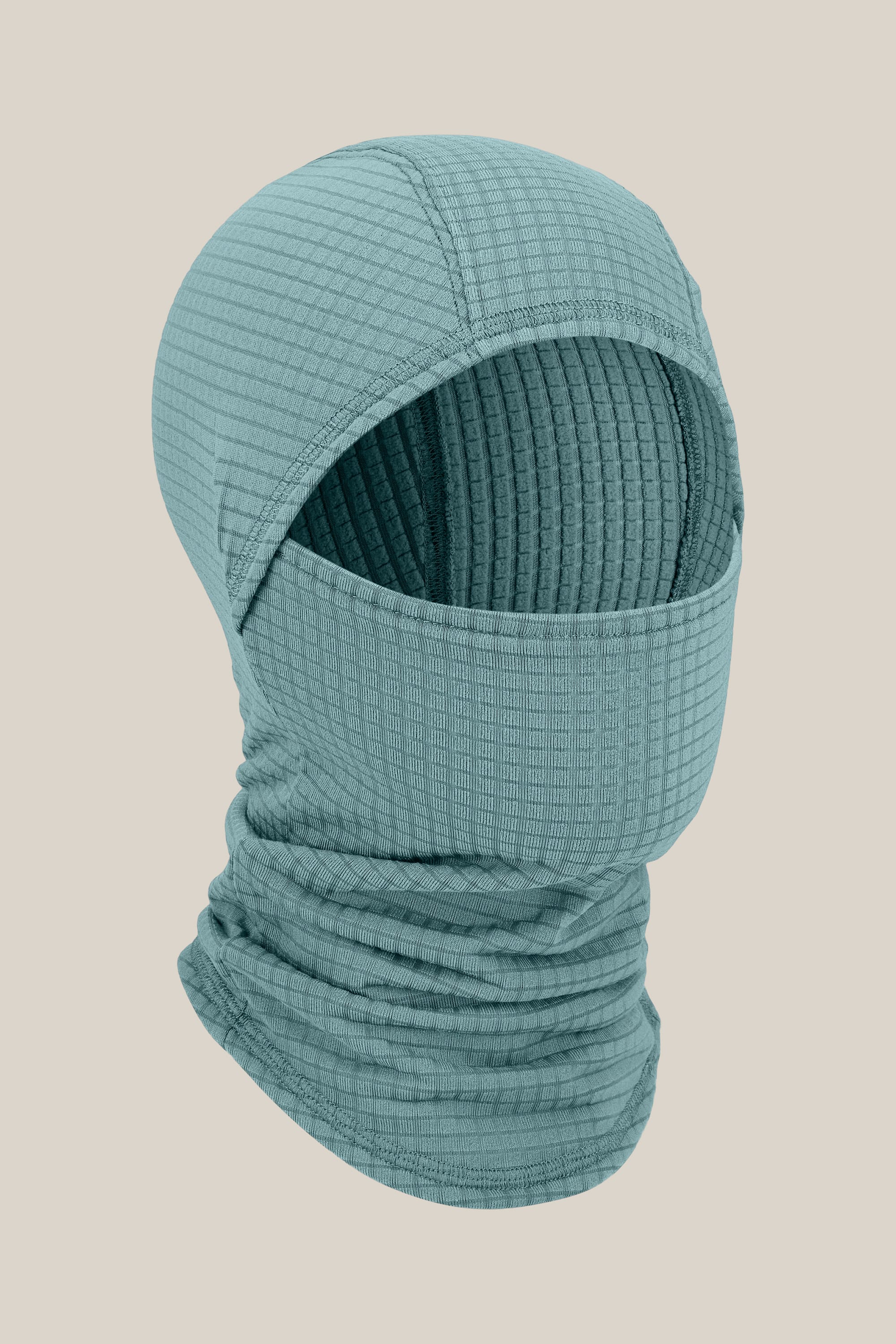 The 686 Mission Grid™ Balaclava by 686 is a teal, textured knit facemask with a grid pattern that covers the entire head, neck, and lower face while leaving only the eyes visible, shown against a plain beige background.