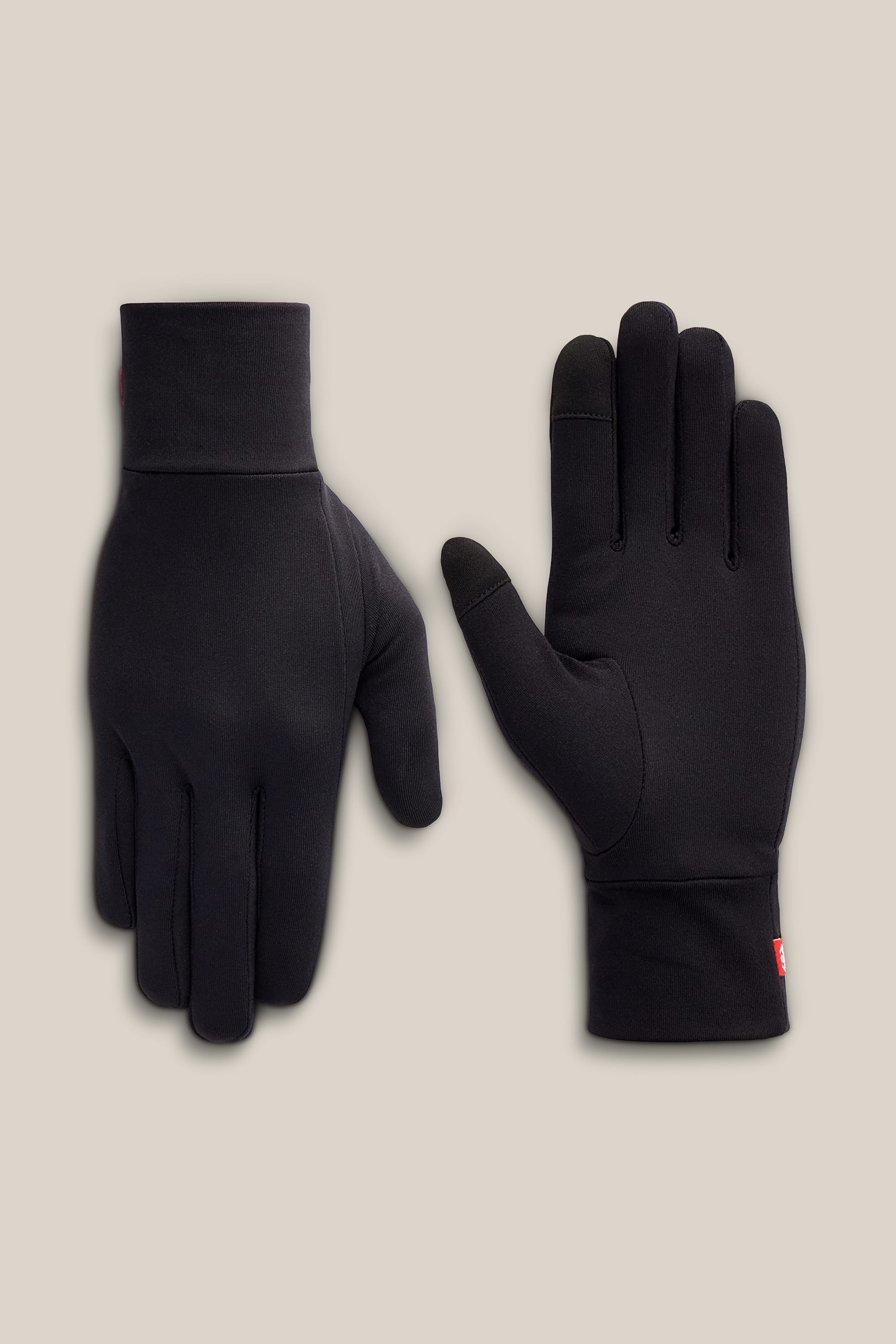 A pair of 686 Women’s Fleece Glove Liners is displayed on a neutral background, with one glove showing the palm side and the other displaying the back.