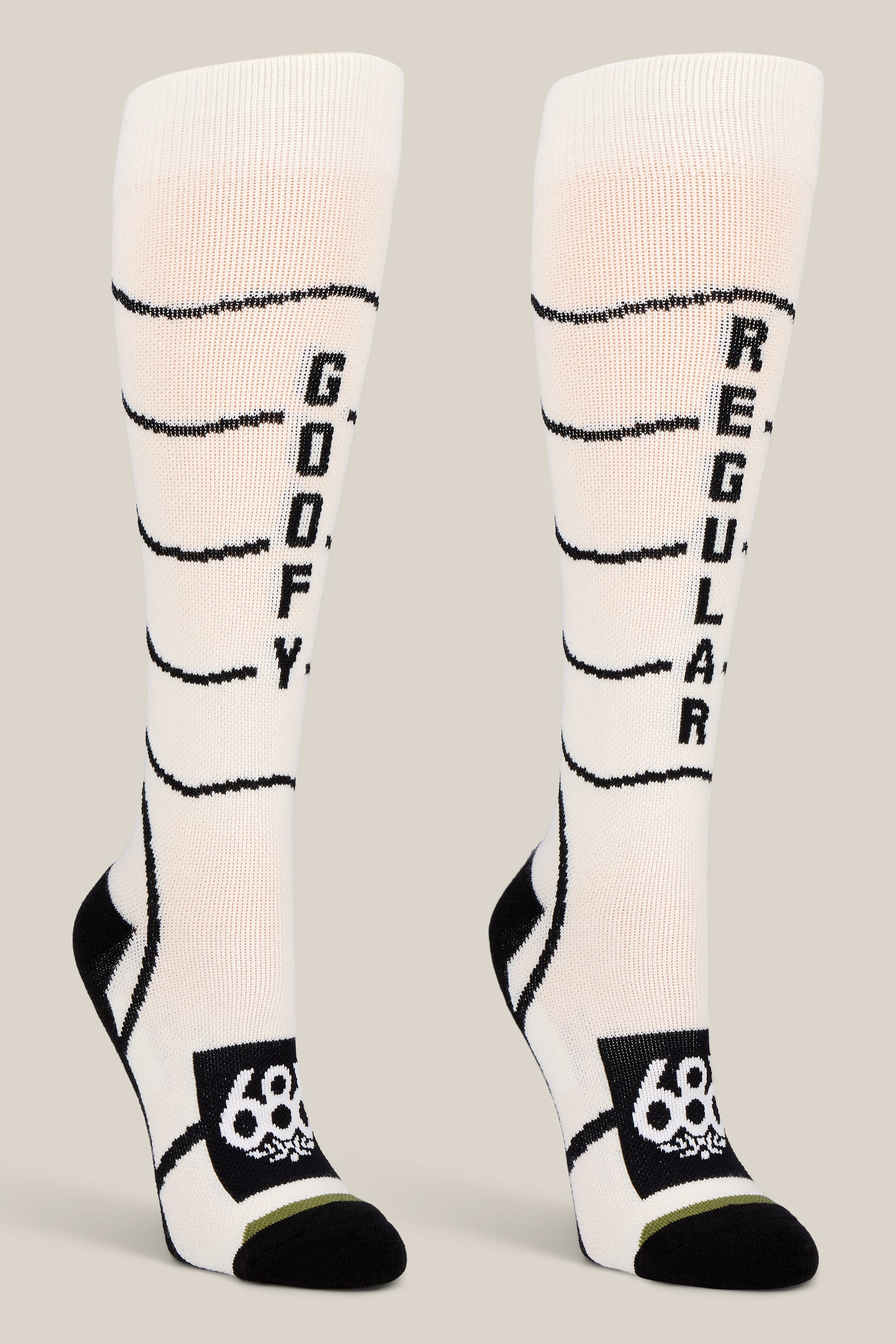 Step up your sock game with the 686 Women’s Contour Merino Sock - 2-Pack from 686—featuring bold white and black knee-high designs, playful “GOOFY” and “REGULAR” text on each sock, stylish horizontal stripes, and a signature logo near the toes. These performance socks are perfect for women seeking both comfort and a fun twist in their collection.
