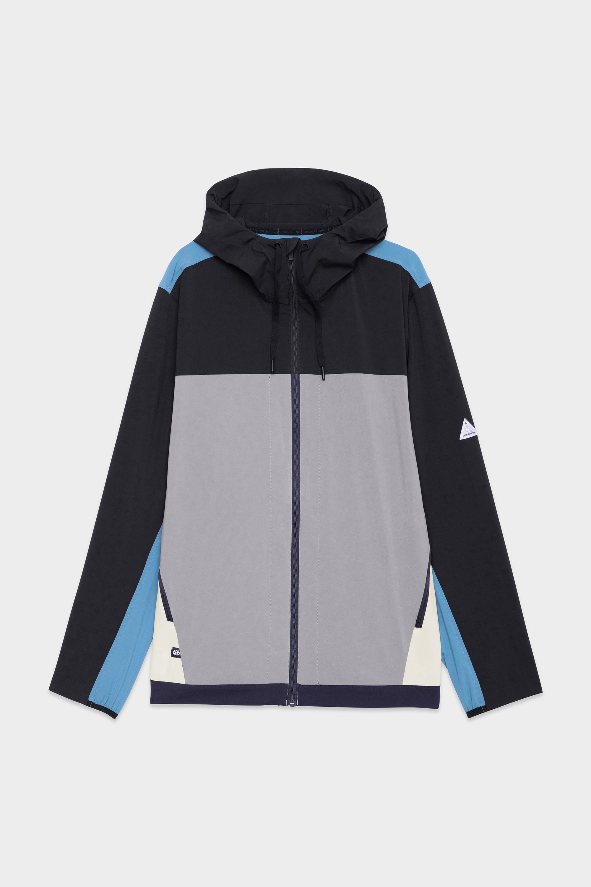 The 686 Mens ATP Stretch Wind Jacket by 686 features black, grey, blue, and cream colorblock panels, a front zipper, drawstring hood, small logo on the left sleeve, and a modern sporty design.