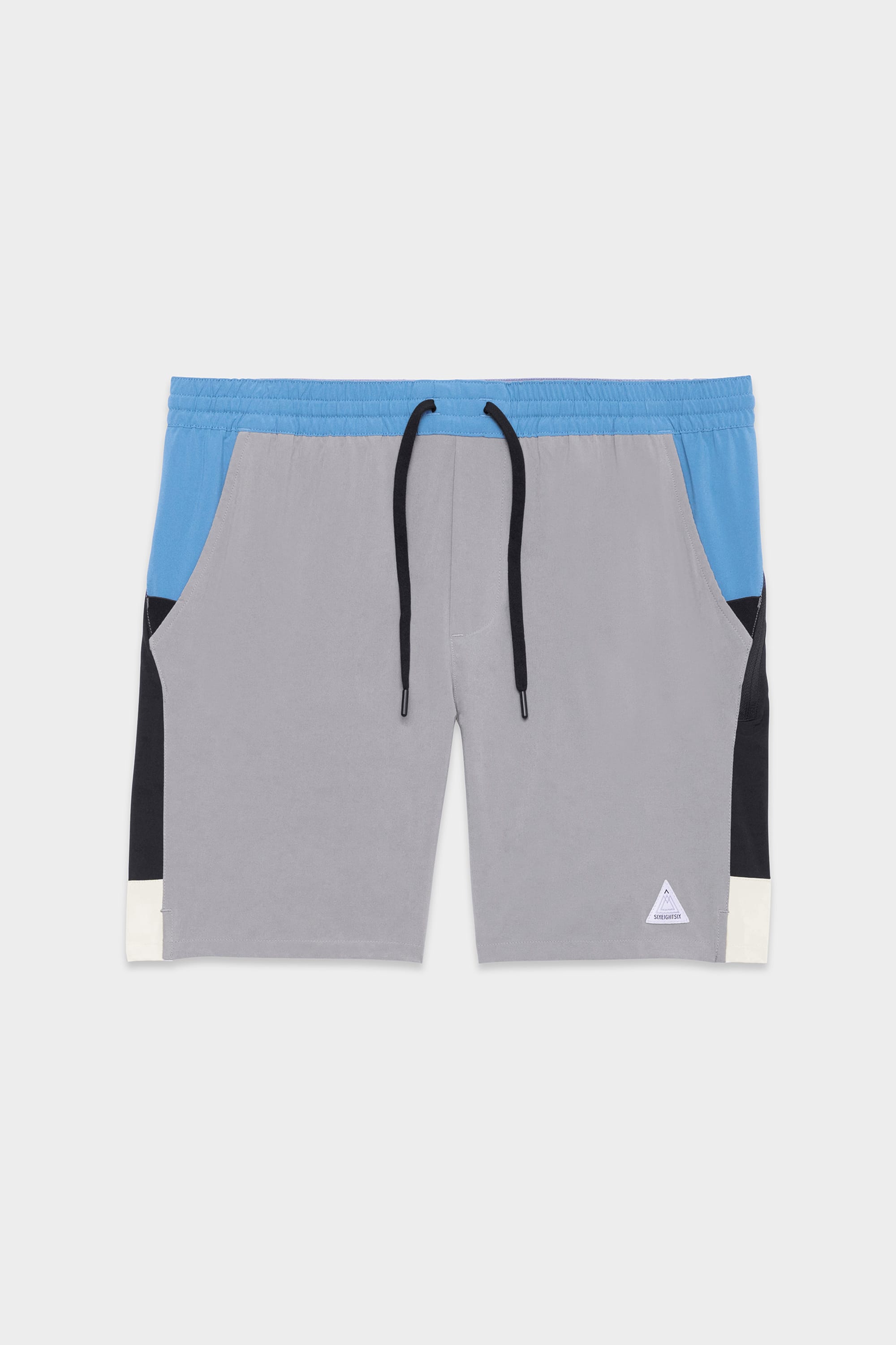 The 686 Mens ATP Stretch Performance Short features a gray front, blue waistband, black side panels, white hem accents, a black drawstring, and a white logo patch near the left hem.